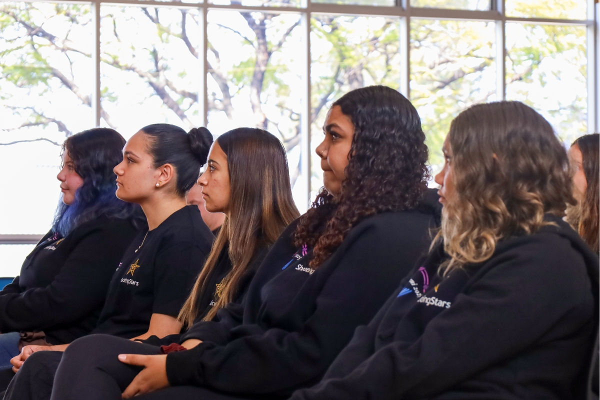 Graduates at the front of the audience at Alumni Graduation