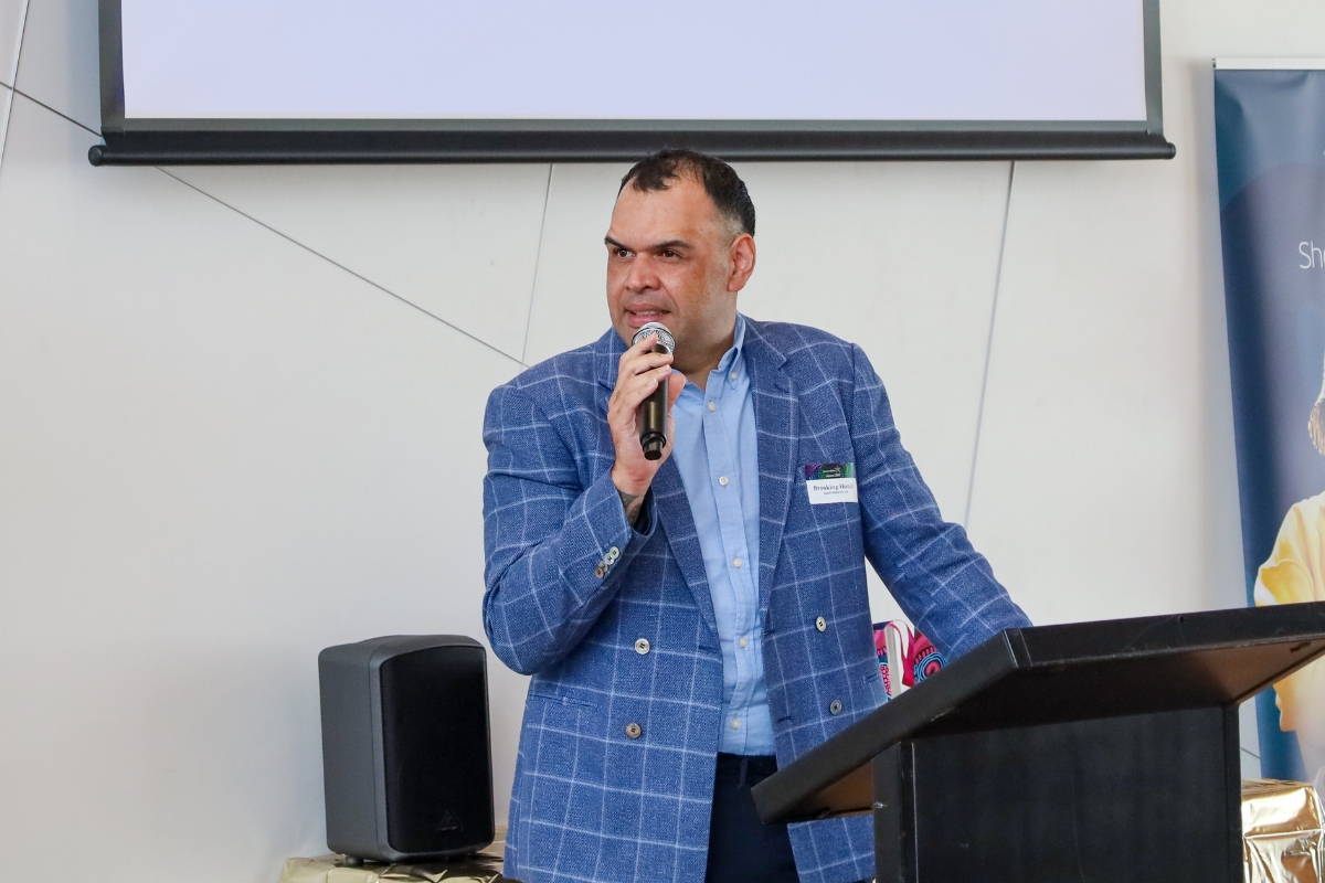 Upskill Global CEO, Brooking Hovell speaking at the lectern 