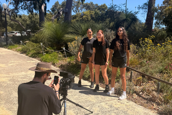Kiara College participants singing while music video is being filmed