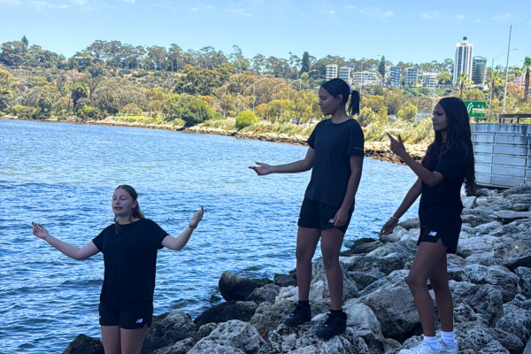 Kiara College participants singing while music video is being filmed